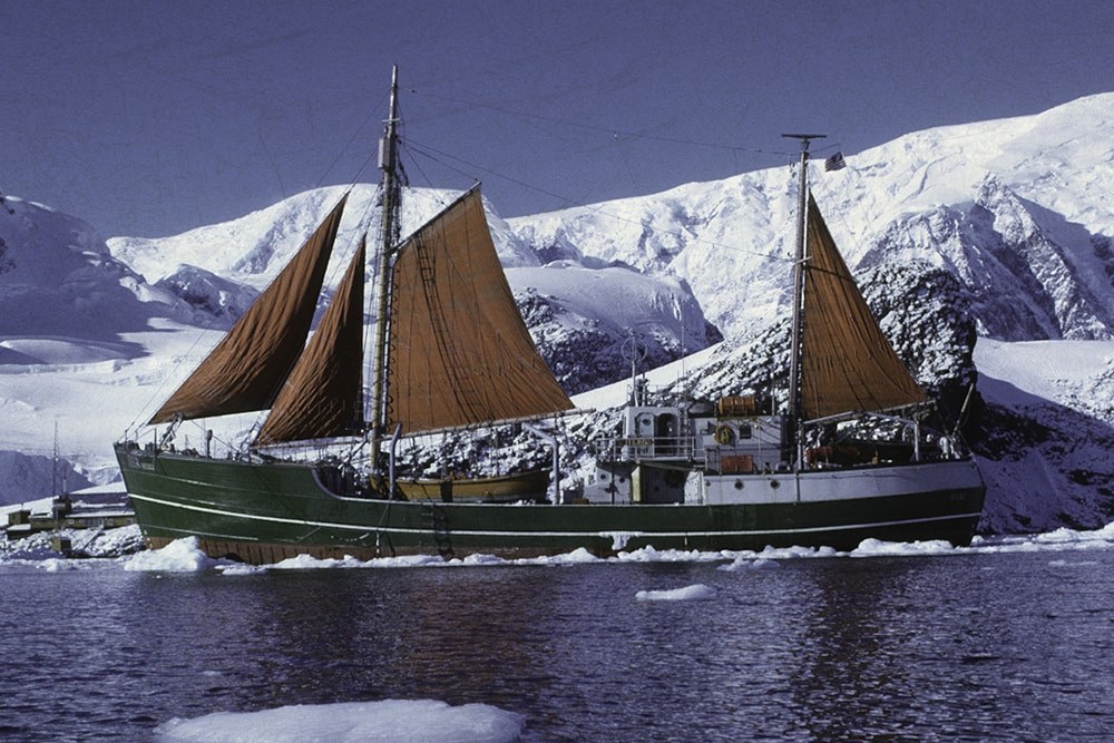 A colour photo of the famous ship in Antarctica surrounded by ice