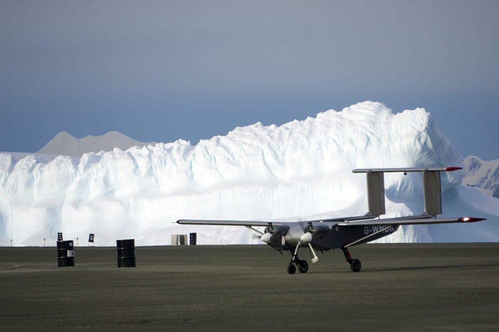 a drone in front of ice cliffs part of the history of climate science in Antarctica