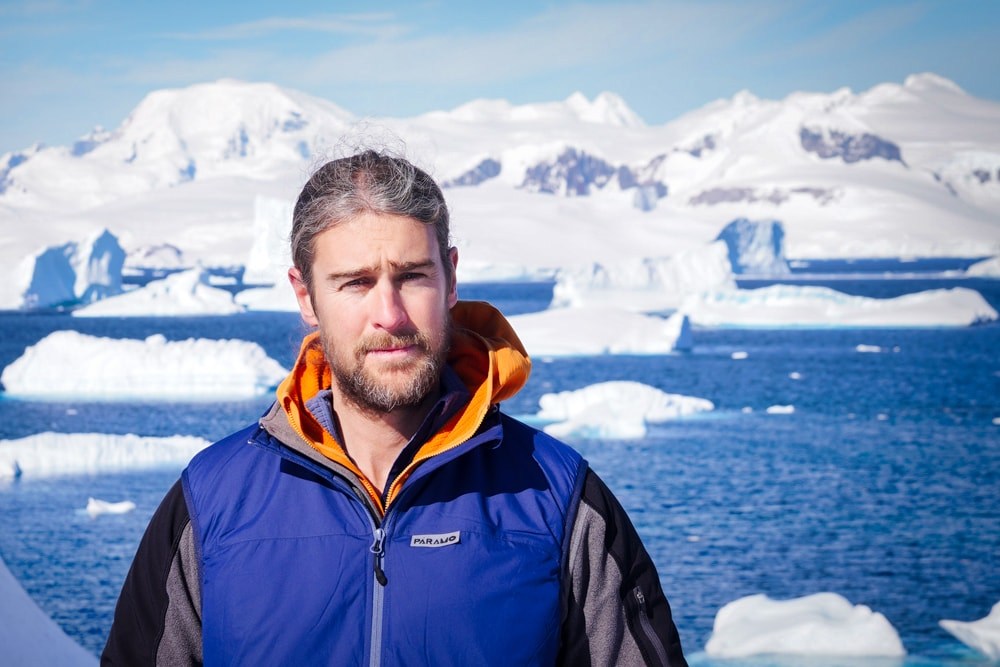 Aj in front of icebergs