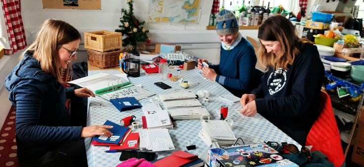 The team stamps and cancels the mail