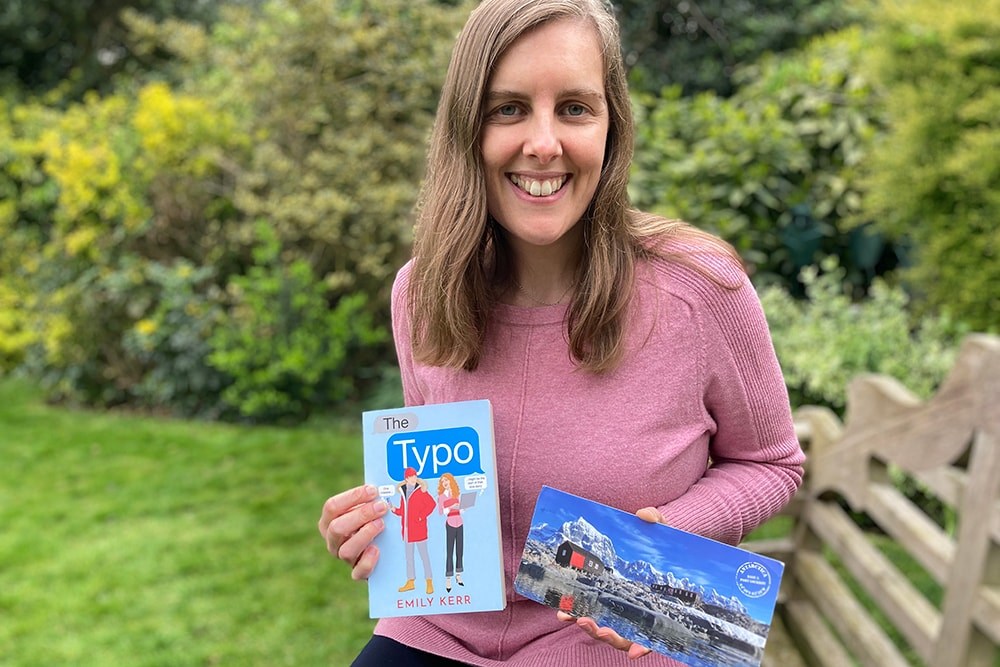 Emily with her book and postcard
