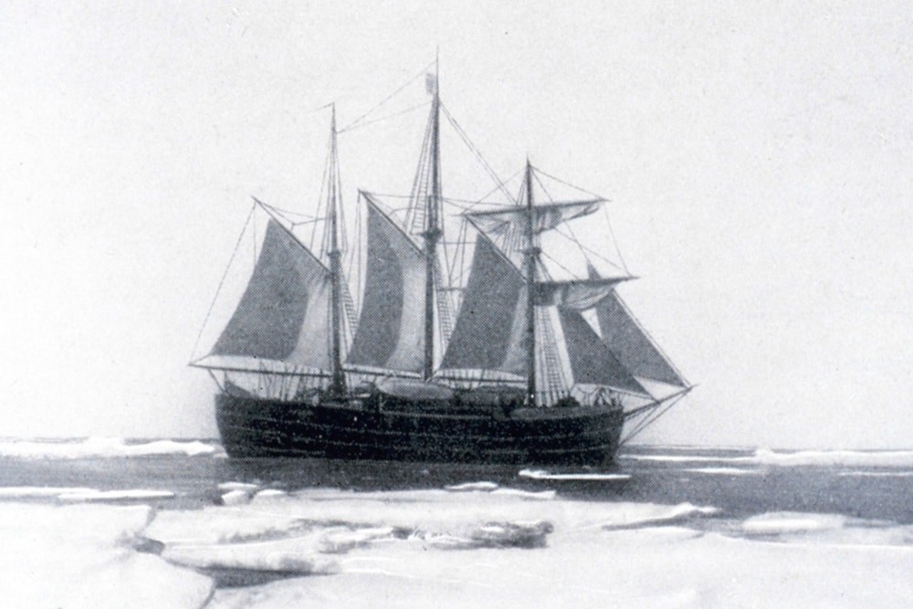 A B&W of the famous ship Fram, under sail in Antarctic waters